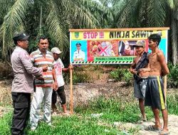 Polsek Tanah Putih Tanjung Melawan Pasang Spanduk “Stop Ninja Sawit” di Mesah