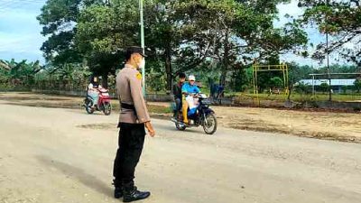 Ciptakan Kamseltibcarlantas, Polsek Pujud Laksanakan Strong Point Pagi